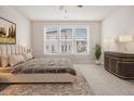 Serene bedroom featuring a comfortable bed, ample natural light, and contemporary furnishings at 1247 Winterhaven Dr, Cumming, GA 30041