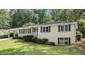 Inviting exterior view showcasing the home's charming curb appeal and carport at 2855 Briarlake Ne Rd, Atlanta, GA 30345