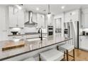 Modern kitchen with granite countertops, stainless steel appliances, and ample cabinet space at 4660 Rosarian Drive, Cumming, GA 30040
