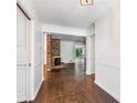 Inviting entryway with hardwood floors and a view of the living room fireplace at 2917 Rockingham Nw Dr, Atlanta, GA 30327