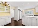 Bright kitchen featuring white cabinets, quartz countertops, and stainless steel appliances at 2917 Rockingham Nw Dr, Atlanta, GA 30327