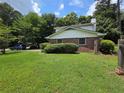 Well-maintained backyard with a mix of grass and greenery, offering privacy and a peaceful atmosphere at 3400 Elm Creek Nw Dr, Marietta, GA 30064