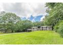 Inviting home exterior with a spacious front yard and carport at 4023 Anvil Block Rd, Ellenwood, GA 30294