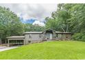 Delightful home with beautiful landscaping and a convenient carport at 4023 Anvil Block Rd, Ellenwood, GA 30294