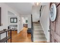 Inviting foyer features hardwood floors, staircase, and stylish decor at 1209 Colony Cir, Marietta, GA 30068