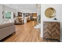Bright open-concept living space with hardwood floors leading to a modern kitchen at 81 Walthall Se St, Atlanta, GA 30316