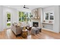 Cozy living room featuring a fireplace and large windows overlooking the yard at 81 Walthall Se St, Atlanta, GA 30316