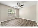 Neutral bedroom with hardwood flooring and natural light at 2479 Heatherton Ct, Dacula, GA 30019