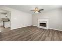 Bright living room featuring a fireplace and hardwood flooring at 2479 Heatherton Ct, Dacula, GA 30019