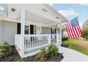 Welcoming front porch with white railing and space for outdoor seating at 456 Pretty View Se Ln, Smyrna, GA 30082