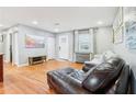 Open-concept living room featuring hardwood floors and recessed lighting at 456 Pretty View Se Ln, Smyrna, GA 30082