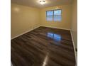 Bedroom with new flooring, window, natural light, base molding, and neutral walls at 6851 Roswell Rd # 15, Atlanta, GA 30328