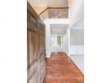 Inviting foyer with hardwood floors, a staircase with rod iron railing, and neutral paint at 1057 Cotton Oak Dr, Lawrenceville, GA 30045