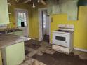 Vintage kitchen featuring laminate countertops, a double sink, and an older oven range; a fixer-upper's dream at 1159 Eastridge Sw Rd, Atlanta, GA 30311