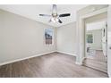 Spacious bedroom with hardwood floors, a ceiling fan, and an adjacent doorway at 190 Judy Sw Ln, Atlanta, GA 30315