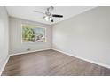 Bright bedroom with hardwood floors, a ceiling fan, and a large window for natural light at 190 Judy Sw Ln, Atlanta, GA 30315