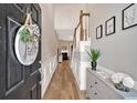 Bright entryway with hardwood floors, staircase, and views into the living area at 2263 Nottley Dr # 2, Marietta, GA 30066