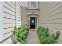 Inviting front entrance with a decorative door and lush green landscaping at 2263 Nottley Dr # 2, Marietta, GA 30066