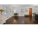 Bright living room featuring beautiful hardwood floors and a cozy sitting area at 476 Concord Se Ln, Smyrna, GA 30082