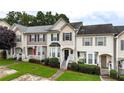 Charming townhome with well-maintained lawn, black shutters, and inviting entrance at 88 Timber Ridge Dr, Cartersville, GA 30121