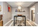 Charming dining room featuring a modern table with seating for four, stylish decor, and neutral color palette at 2479 Peachtree Ne Rd # 201, Atlanta, GA 30305