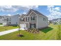 Attractive two-story home showcasing brick and siding, complemented by a well-manicured lawn and modern design at 2929 Champions Way, Loganville, GA 30052