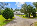 Charming two-story farmhouse with a covered porch and well-manicured lawn at 639 Hall Station Rd, Kingston, GA 30145