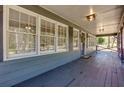 Inviting front porch with ample windows and warm lighting, perfect for relaxing outdoors at 216 Hickory Way, Canton, GA 30115