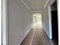 Hallway in the house leads to other rooms at 5444 Miravista Way, Hoschton, GA 30548