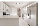 Bright kitchen with stainless steel appliances, white cabinets, and quartz countertops at 4252 Keheley Lake Dr, Marietta, GA 30066