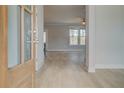 Inviting entryway with natural light, neutral walls, and stylish light wood-look flooring at 100 Homesite Valleyview Ct, Mcdonough, GA 30252
