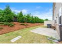 Serene backyard with fresh green grass, mulch beds, and a privacy fence for outdoor relaxation at 2170 Trelipe Dr, Lawrenceville, GA 30044
