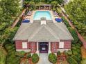 Aerial view of a community pool house with well-maintained landscaping and surrounding greenery at 3635 E Paces Ne Cir # 1405, Atlanta, GA 30326