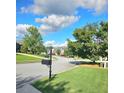 A quiet residential street view with well-kept lawns and clear skies at 532 Mount Gerizim Se Rd, Mableton, GA 30126