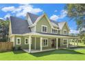 Inviting two-story home with an expansive covered porch, perfect for relaxing outdoors at 529 Claude Scott Rd, Canton, GA 30115