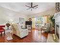 Cozy living room with a fireplace, hardwood floors, and comfortable seating, creating a warm ambiance at , Buford, GA 30518