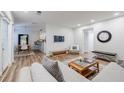 Open-concept living room and dining area with wood floors and lots of natural light at 1445 Monroe Ne Dr # C32, Atlanta, GA 30324