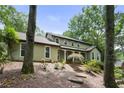 This inviting home features an exterior with mature trees offering shade and natural beauty at 300 Stone Mill Trl, Atlanta, GA 30328