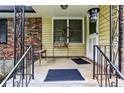 Inviting front porch with decorative railings and a seating area for relaxing at 1263 Blueberry Trl, Decatur, GA 30033