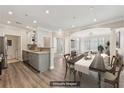 Bright living room featuring modern floors, neutral paint, and dining area at 4203 Stratford Commons # 4203, Decatur, GA 30033