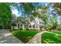 Charming home featuring a well-maintained lawn, stone walkway, and inviting curb appeal at 440 Junction Trak, Roswell, GA 30075