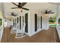 Spacious porch featuring rocking chairs and ceiling fans for relaxing outdoor living at 440 Junction Trak, Roswell, GA 30075