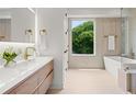 Modern bathroom with a sleek soaking tub, stylish fixtures, and a large window offering natural light at 1102 Sanders Se Ave, Atlanta, GA 30316