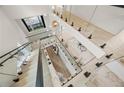 Aerial view of a contemporary interior featuring an open staircase, modern lighting, and stylish living space at 1102 Sanders Se Ave, Atlanta, GA 30316
