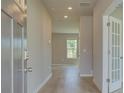 Inviting foyer features light wood floors, neutral walls, and access to other rooms at 568 Teversham Dr, Mcdonough, GA 30253