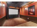 Home theater with movie screen, overhead lighting, and wall decor at 4046 Water Hole Ct, Douglasville, GA 30135