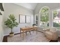 Inviting home office with natural light, modern decor, and ample workspace at 5007 Highland Oaks Se Ct, Smyrna, GA 30126