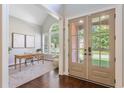 Bright home office with large windows, neutral colors, and vaulted ceilings at 5007 Highland Oaks Se Ct, Smyrna, GA 30126