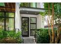 Modern home featuring a stylish front door and well-kept landscaping at 670 Willoughby Ne Way, Atlanta, GA 30312