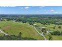 Aerial view of the acreage property with a white border line at 14501 Woolsey Rd, Hampton, GA 30228